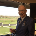 Forcht: a man in a suit smiling at the camera