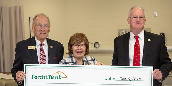 forcht family with president of the university of the cumberlands holding a big check