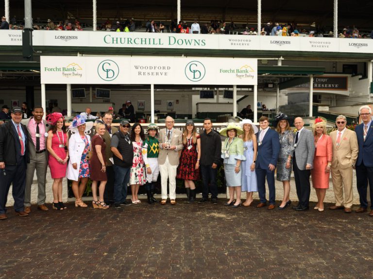 Forcht Bank: group of people posing for the camera with a jockey