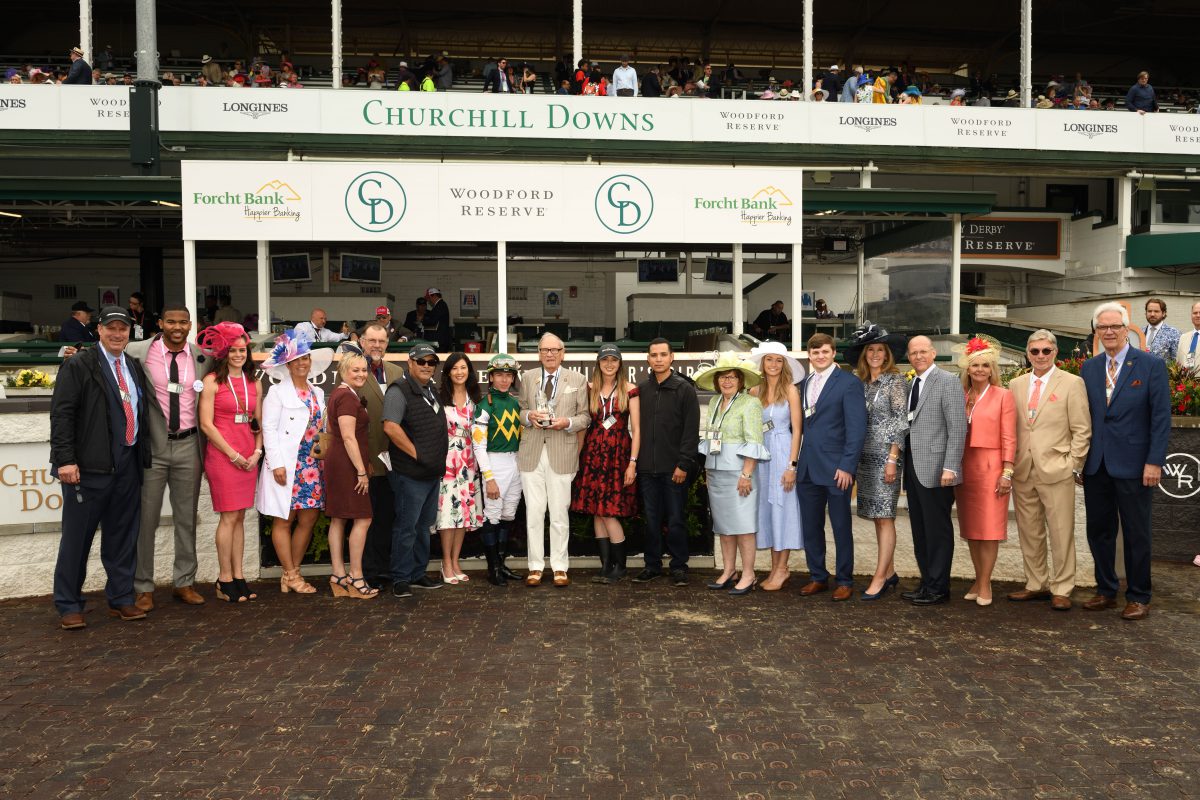 Forcht Bank: group of people posing for the camera with a jockey