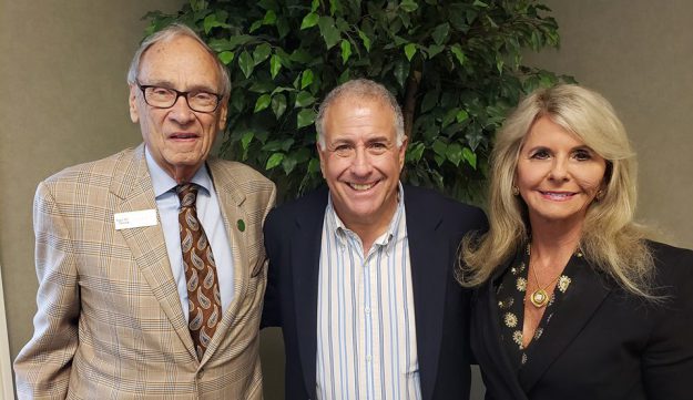 forcht broadcasting Terry Forcht and Mrs. Debbie with anchor Peter King smiling at the camera