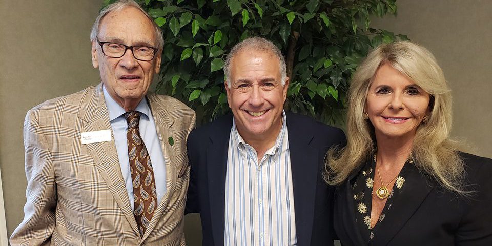 forcht broadcasting Terry Forcht and Mrs. Debbie with anchor Peter King smiling at the camera